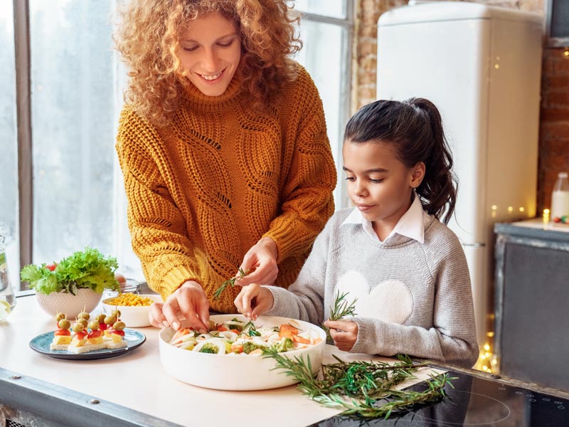 mother and daughter cooking together